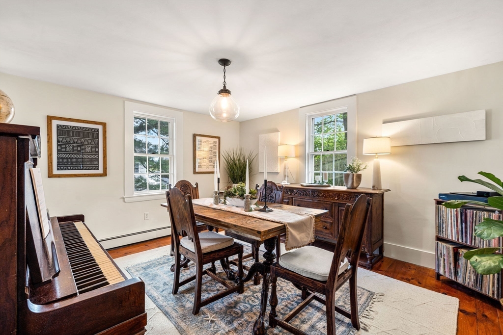 159 Elm Street, Unit 2 Marblehead, MA 01945 - Photo 15 of 34 a view of a dining room with furniture window and wooden floor
