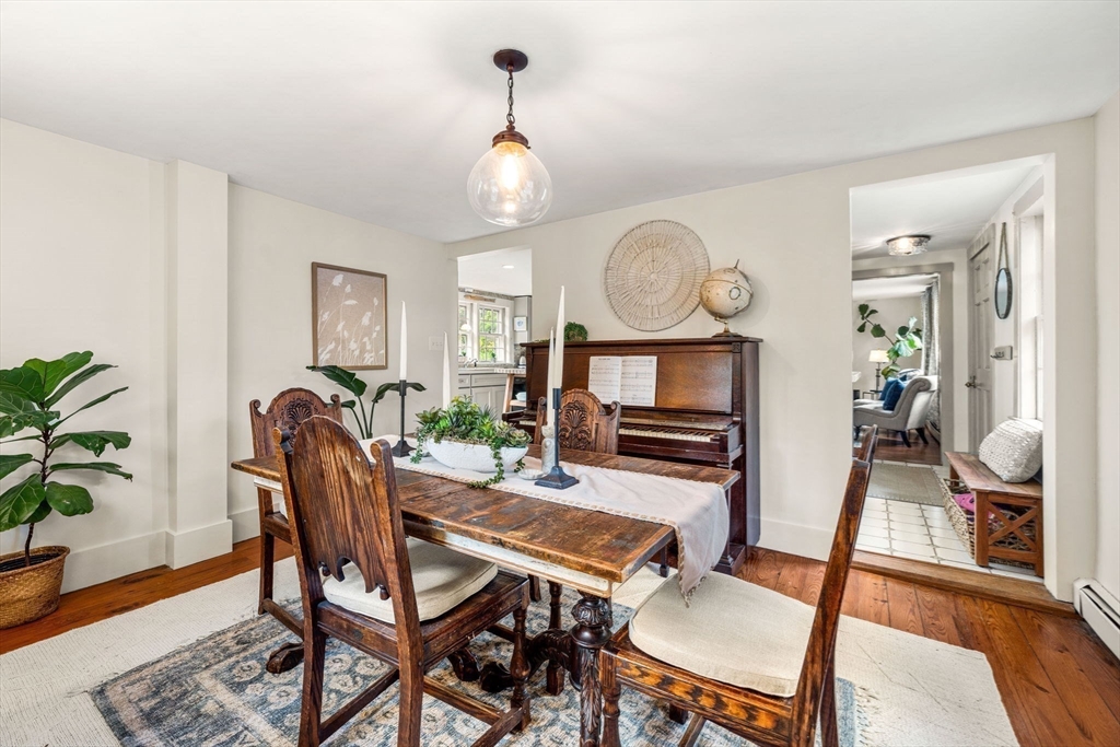 159 Elm Street, Unit 2 Marblehead, MA 01945 - Photo 17 of 34 a view of a dining room with furniture window and wooden floor
