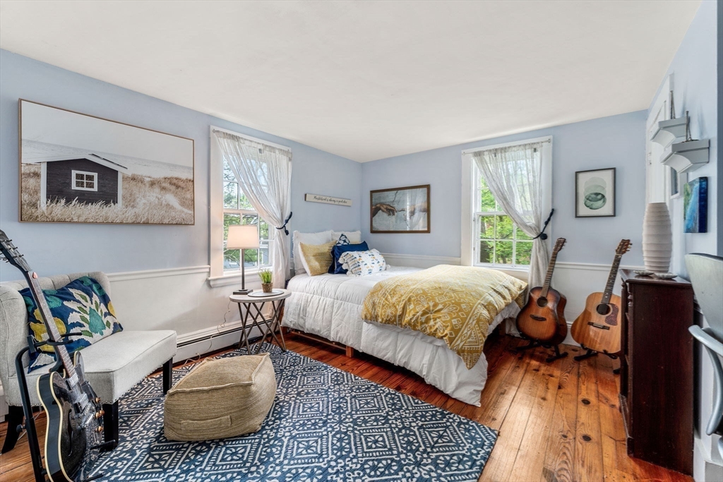159 Elm Street, Unit 2 Marblehead, MA 01945 - Photo 23 of 34 a bed room with a bed and a couch