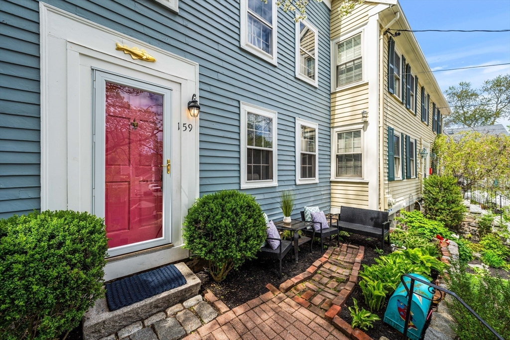 159 Elm Street, Unit 2 Marblehead, MA 01945 - Photo 5 of 34 a house with trees in front of it