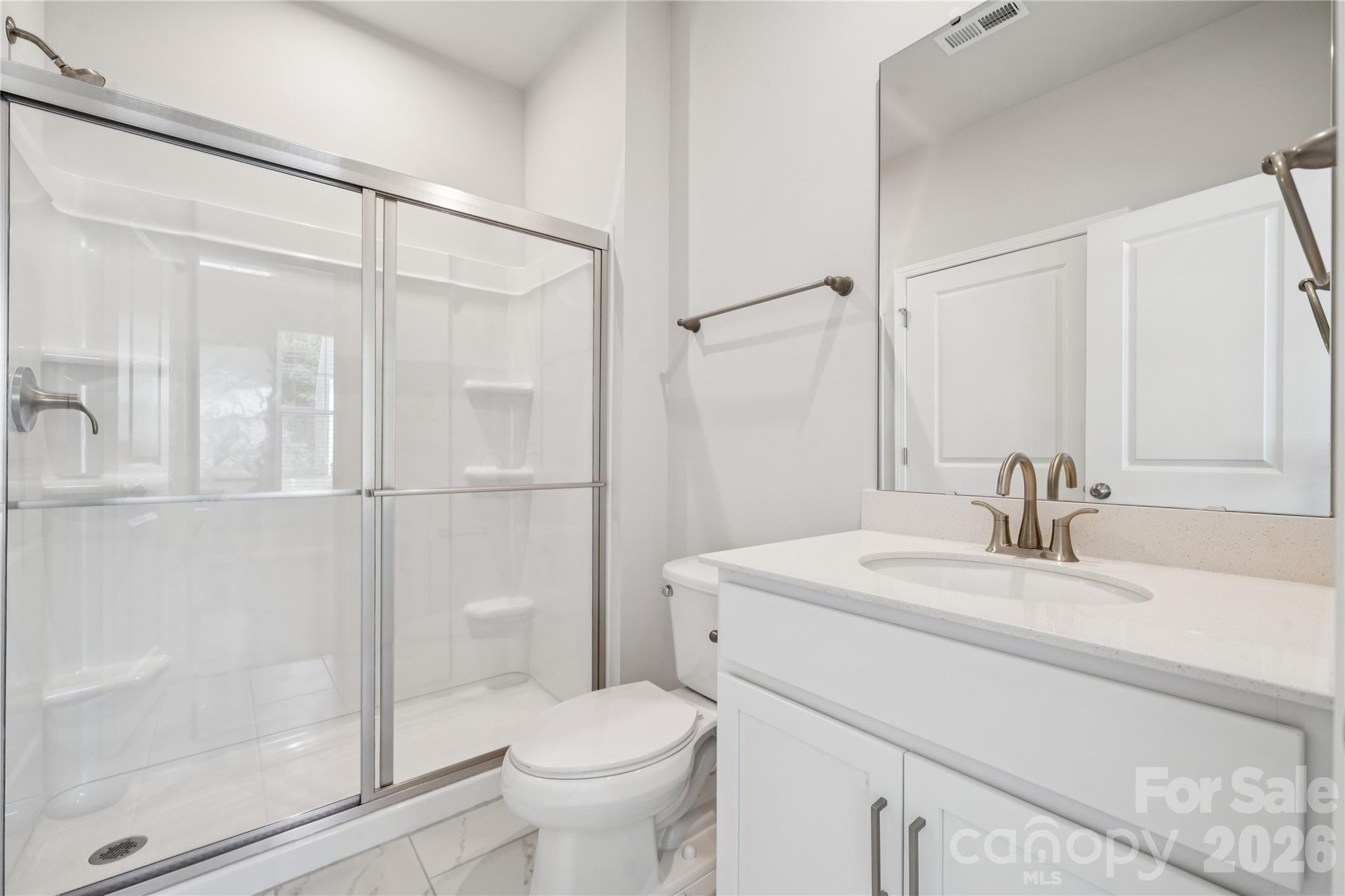416 Alameda Way Matthews, NC 28104 - Photo 15 of 36 a bathroom with a sink a toilet and shower