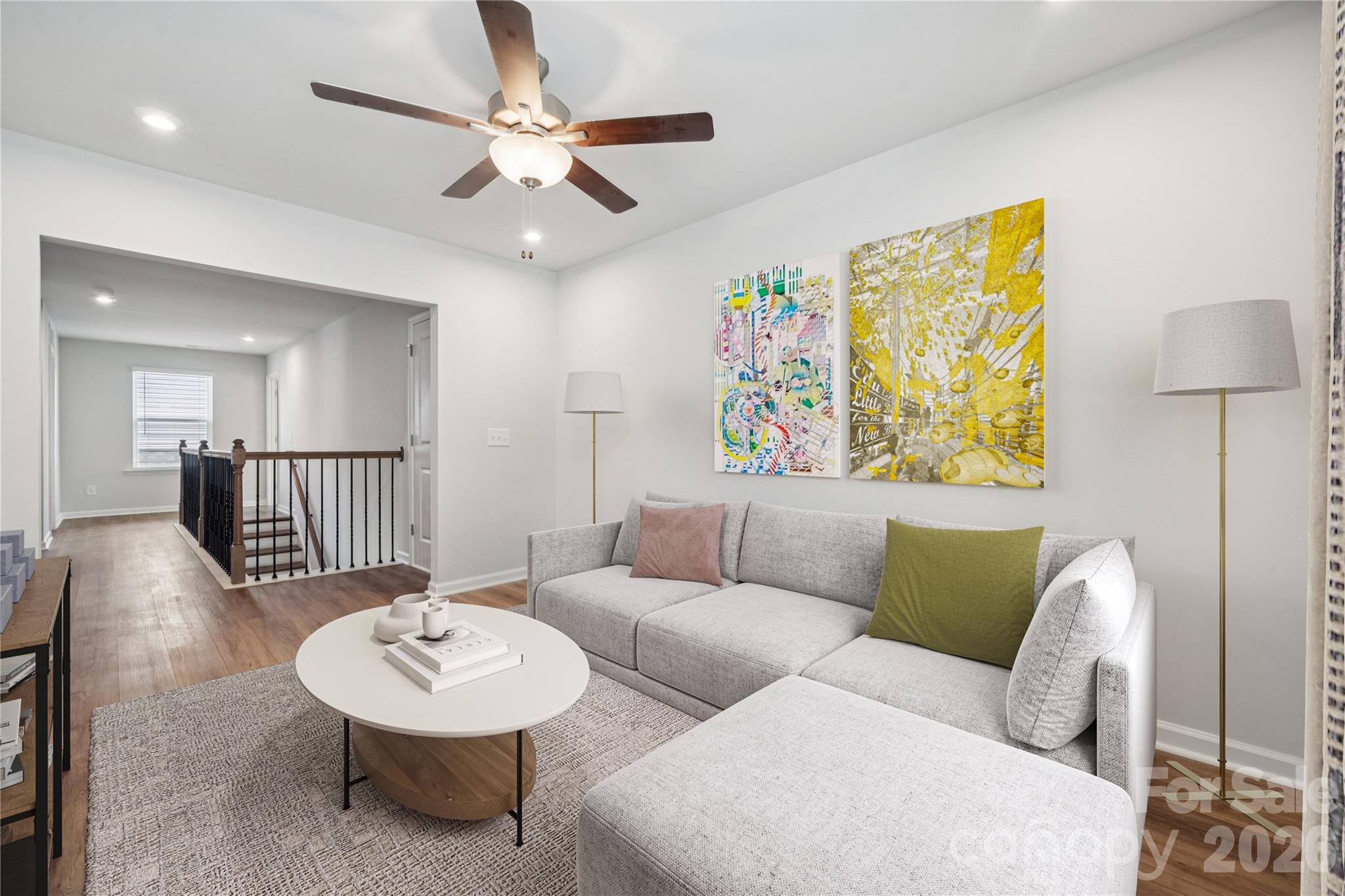 416 Alameda Way Matthews, NC 28104 - Photo 20 of 36 a living room with furniture and a wooden floor