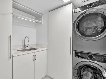 a living room with furniture kitchen view and a table