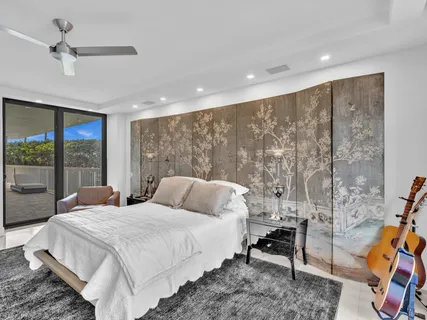 a view of a patio with couches table and chairs and potted plants