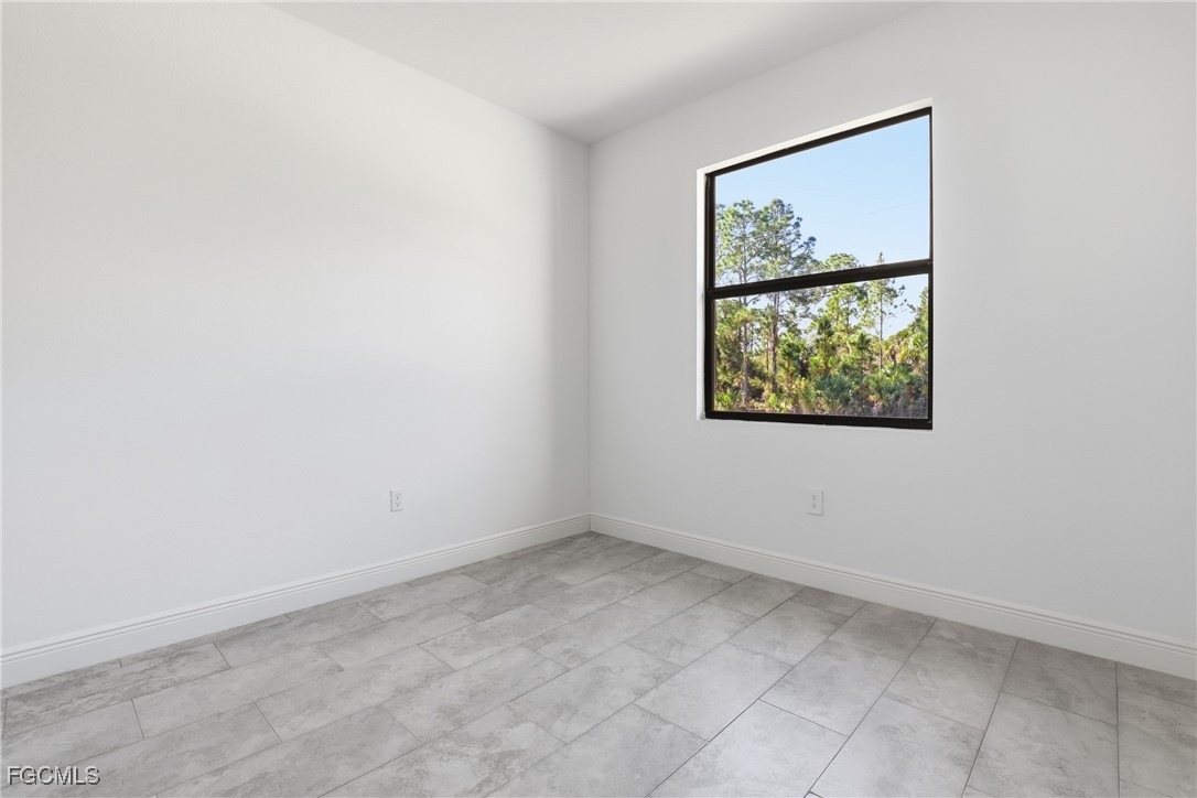 1087 Rugby Circle LaBelle, FL 33935 - Photo 12 of 19 an empty room with windows and closet