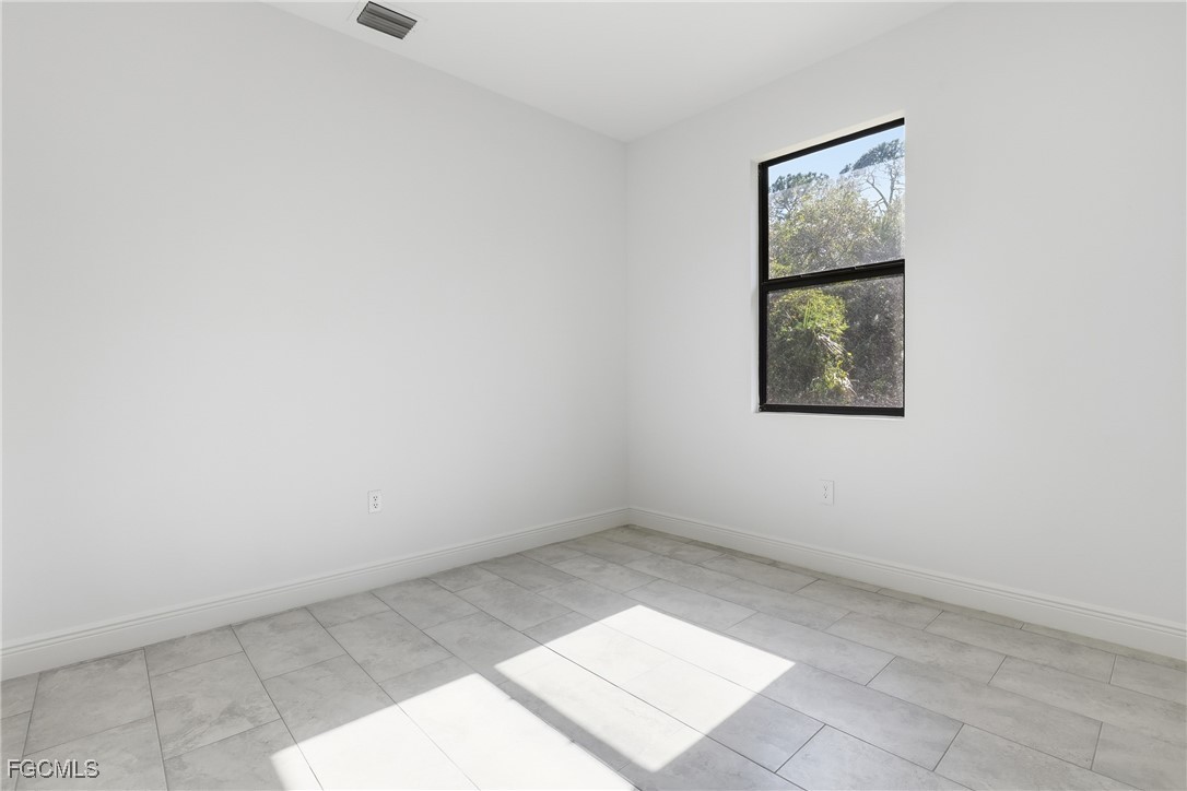 1087 Rugby Circle LaBelle, FL 33935 - Photo 14 of 19 an empty room with a window