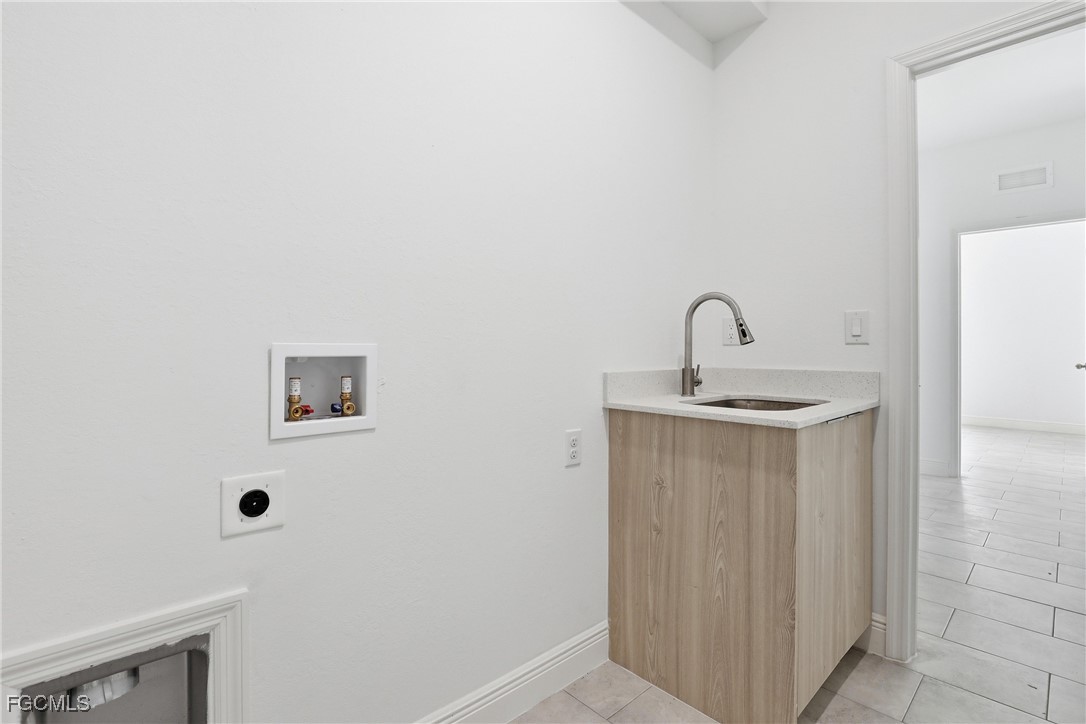 1087 Rugby Circle LaBelle, FL 33935 - Photo 18 of 19 a bathroom with a sink