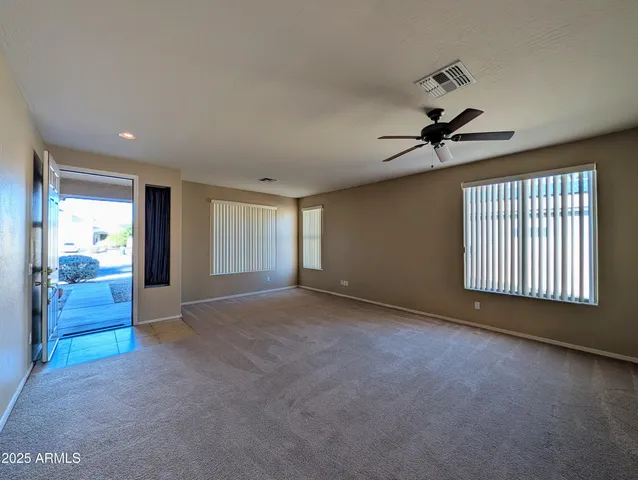 a room with sink a refrigerator and washer