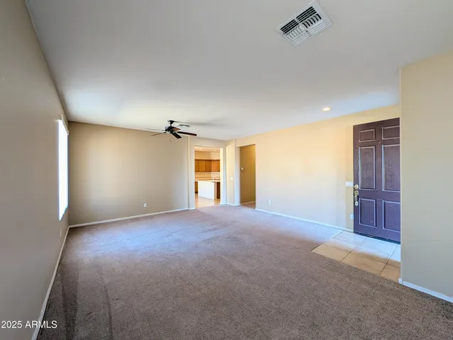 a kitchen with stainless steel appliances granite countertop a sink and a refrigerator