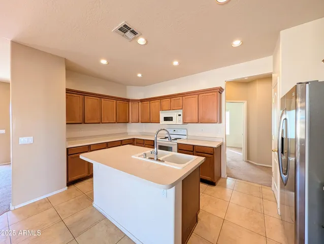 a kitchen with a sink cabinets and window