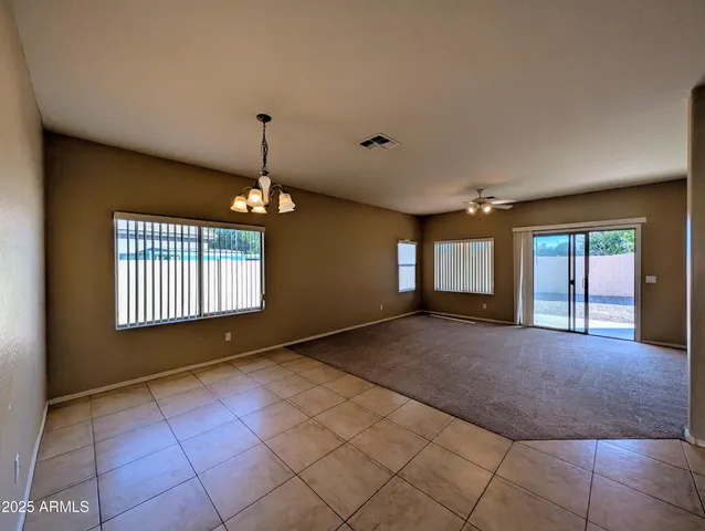 a view of a hallway with wooden shelves