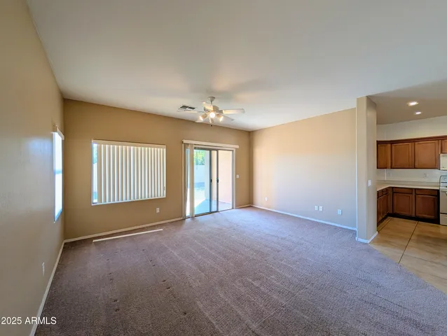 a view of a hallway with wooden shelves