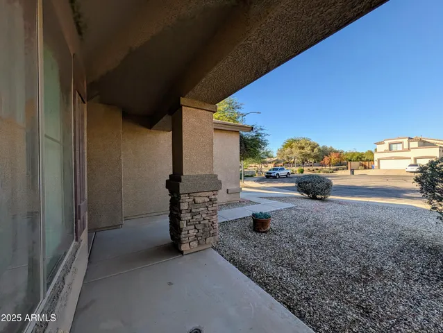 a view of a livingroom with a ceiling fan and window