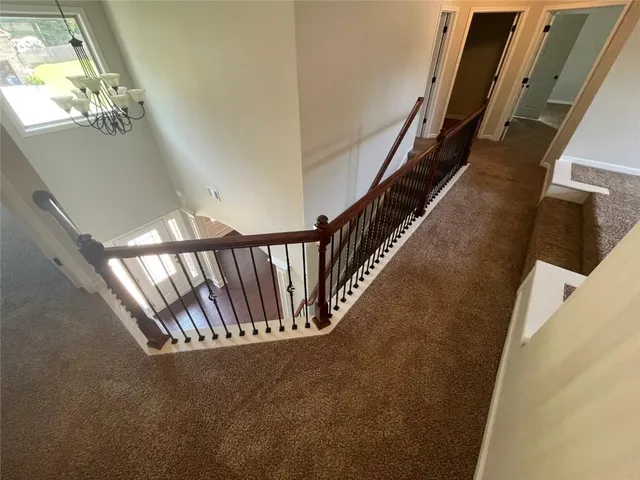 a view of a hallway with staircase