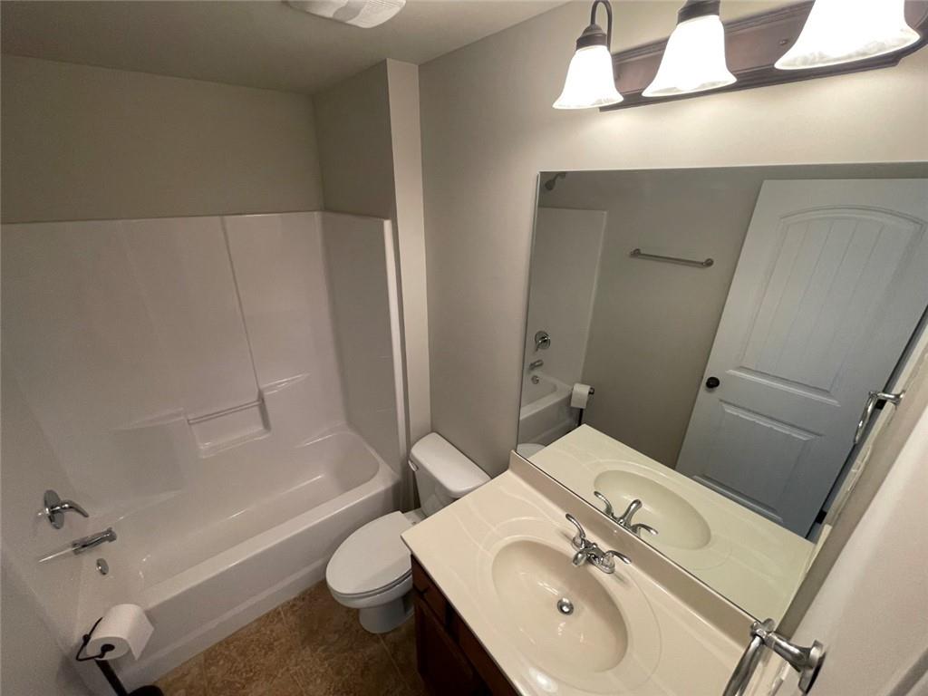 4810 Haysboro Way Cumming, GA 30040 - Photo 25 of 48 a bathroom with a sink a toilet and shower