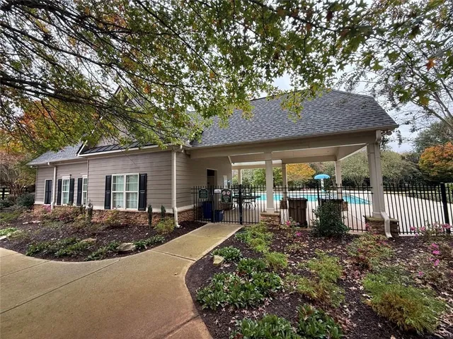 a view of a swimming pool with a porch