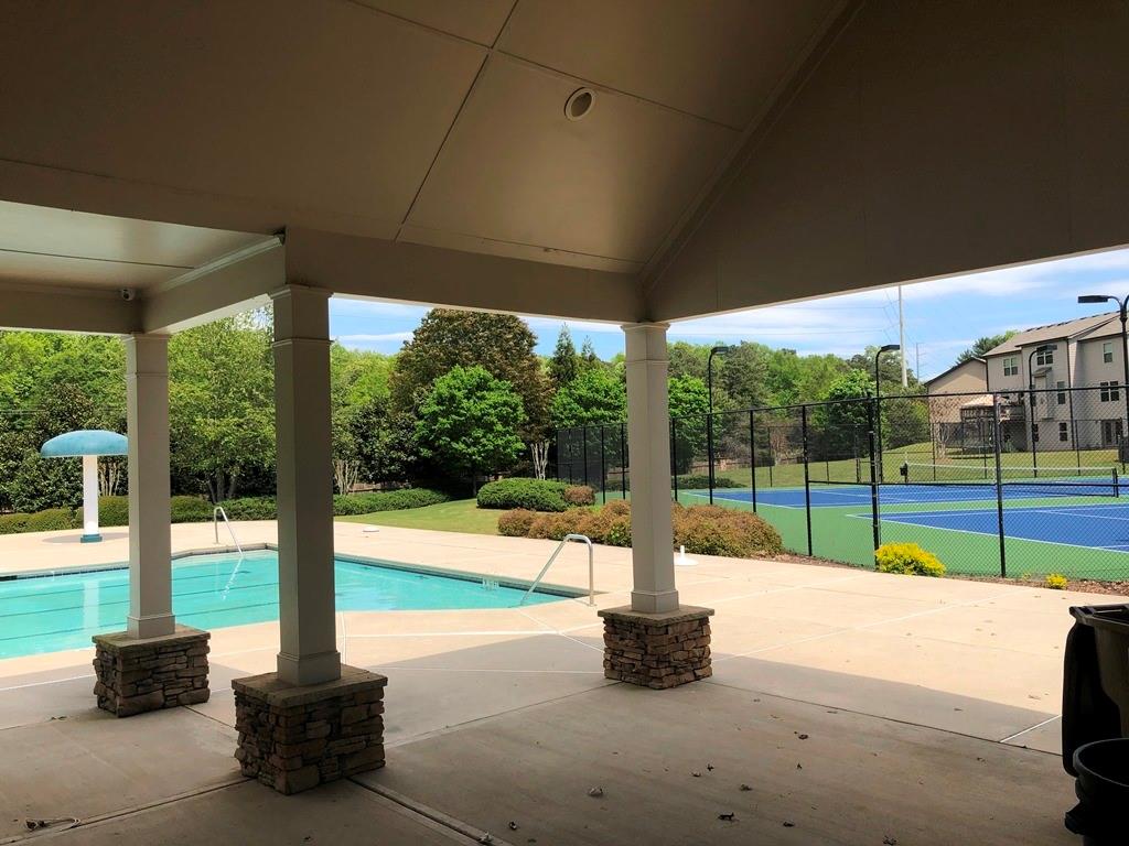4810 Haysboro Way Cumming, GA 30040 - Photo 34 of 48 a view of a swimming pool with a porch