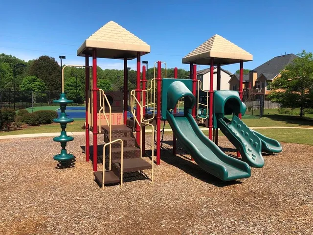 a view of a park with swings