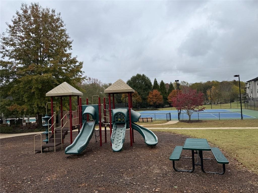 4810 Haysboro Way Cumming, GA 30040 - Photo 43 of 48 a view of a park with swings