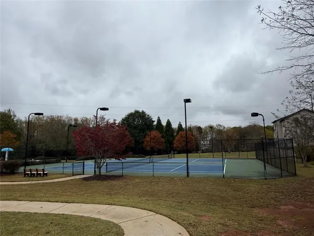 a sign that is sitting on a wooden floor