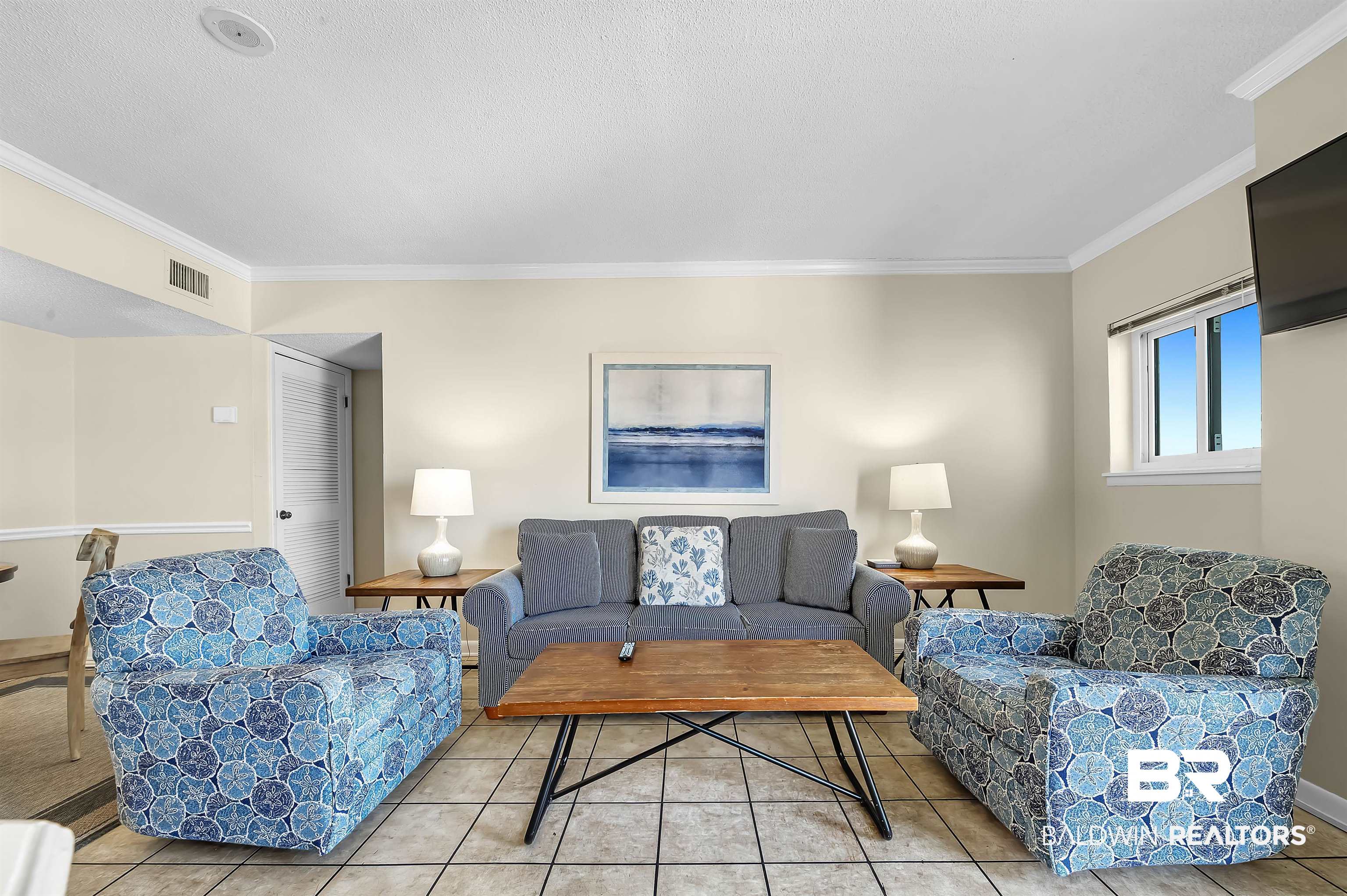 375 Plantation Road, Unit 5409 Gulf Shores, AL 36542 - Photo 3 of 48 Tiled living room with crown molding