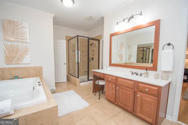 a bathroom with a glass shower door