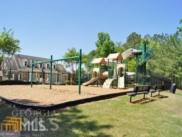 a view of a tennis ground with a yard