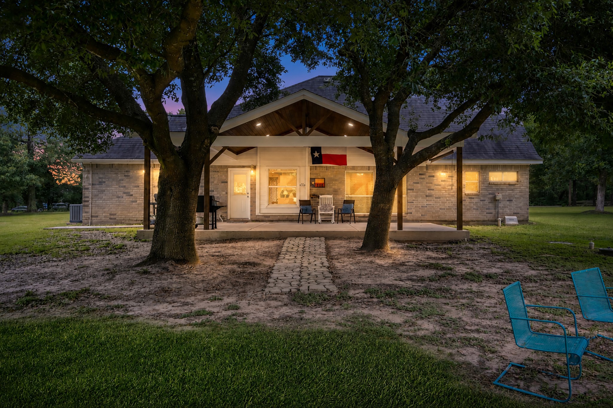 14909 Pine Tree Road Montgomery, TX 77356 - Photo 47 of 49 Beautiful twilight view of the back of home and patio area