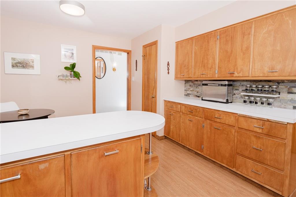 555 North 9th Street Indiana, PA 15701 - Photo 11 of 38 a kitchen with stainless steel appliances a sink cabinets and wooden floor