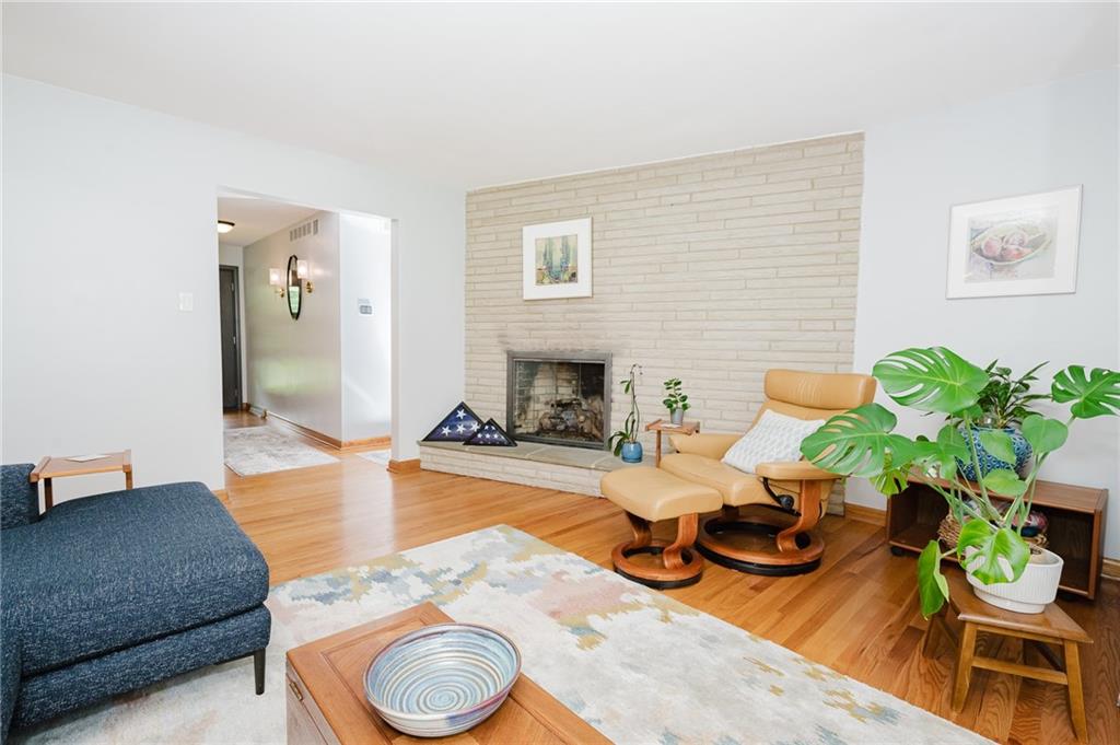 555 North 9th Street Indiana, PA 15701 - Photo 18 of 38 a living room with furniture a fireplace a potted plant and a fireplace