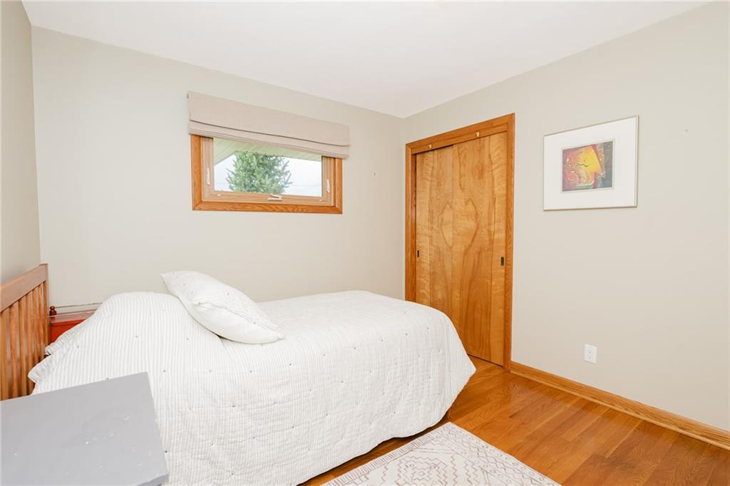 555 North 9th Street Indiana, PA 15701 - Photo 20 of 38 a bedroom with a bed and a painting on the wall