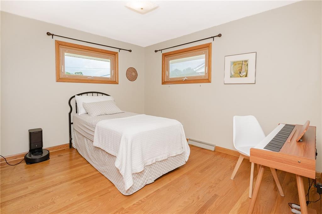 555 North 9th Street Indiana, PA 15701 - Photo 21 of 38 a bedroom with a bed and a chair