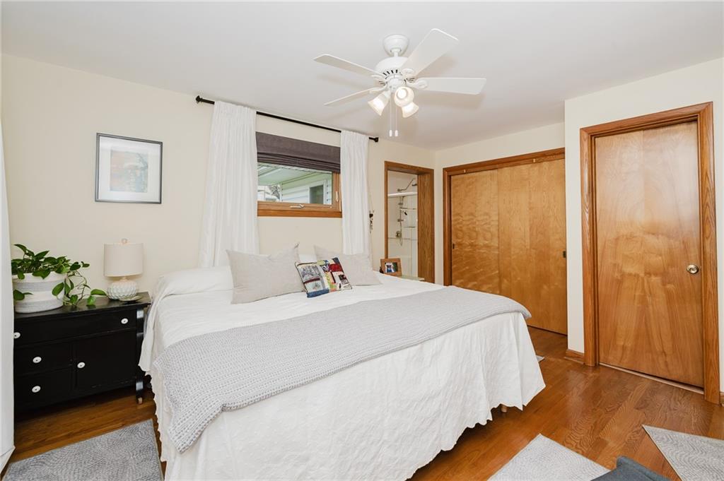 555 North 9th Street Indiana, PA 15701 - Photo 25 of 38 a bedroom with a bed and a chandelier