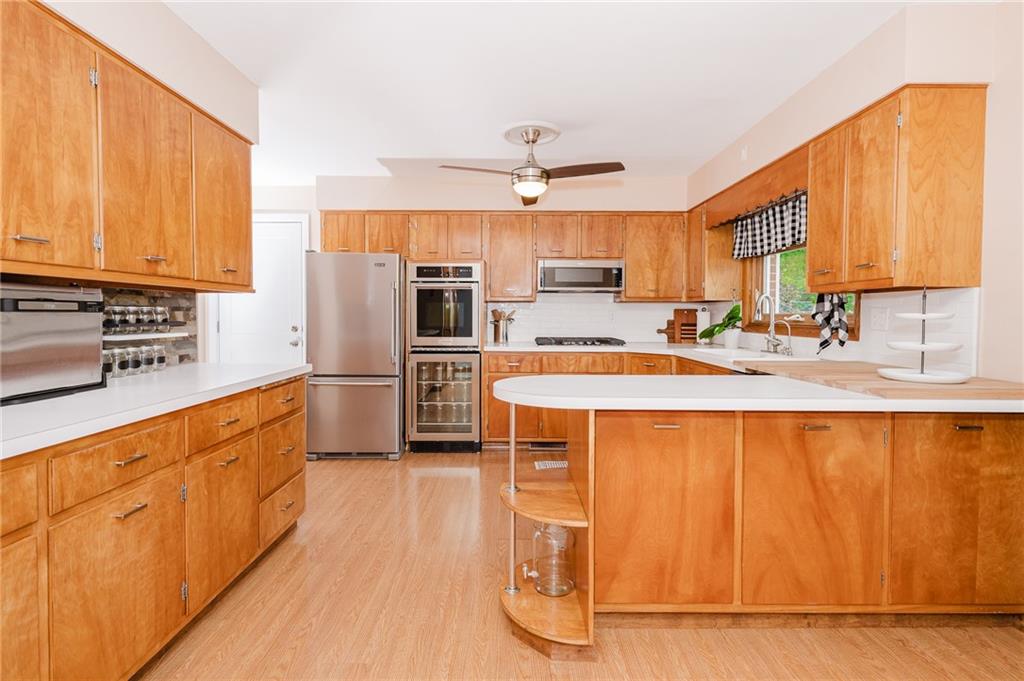 555 North 9th Street Indiana, PA 15701 - Photo 8 of 38 a kitchen with stainless steel appliances a refrigerator sink and cabinets