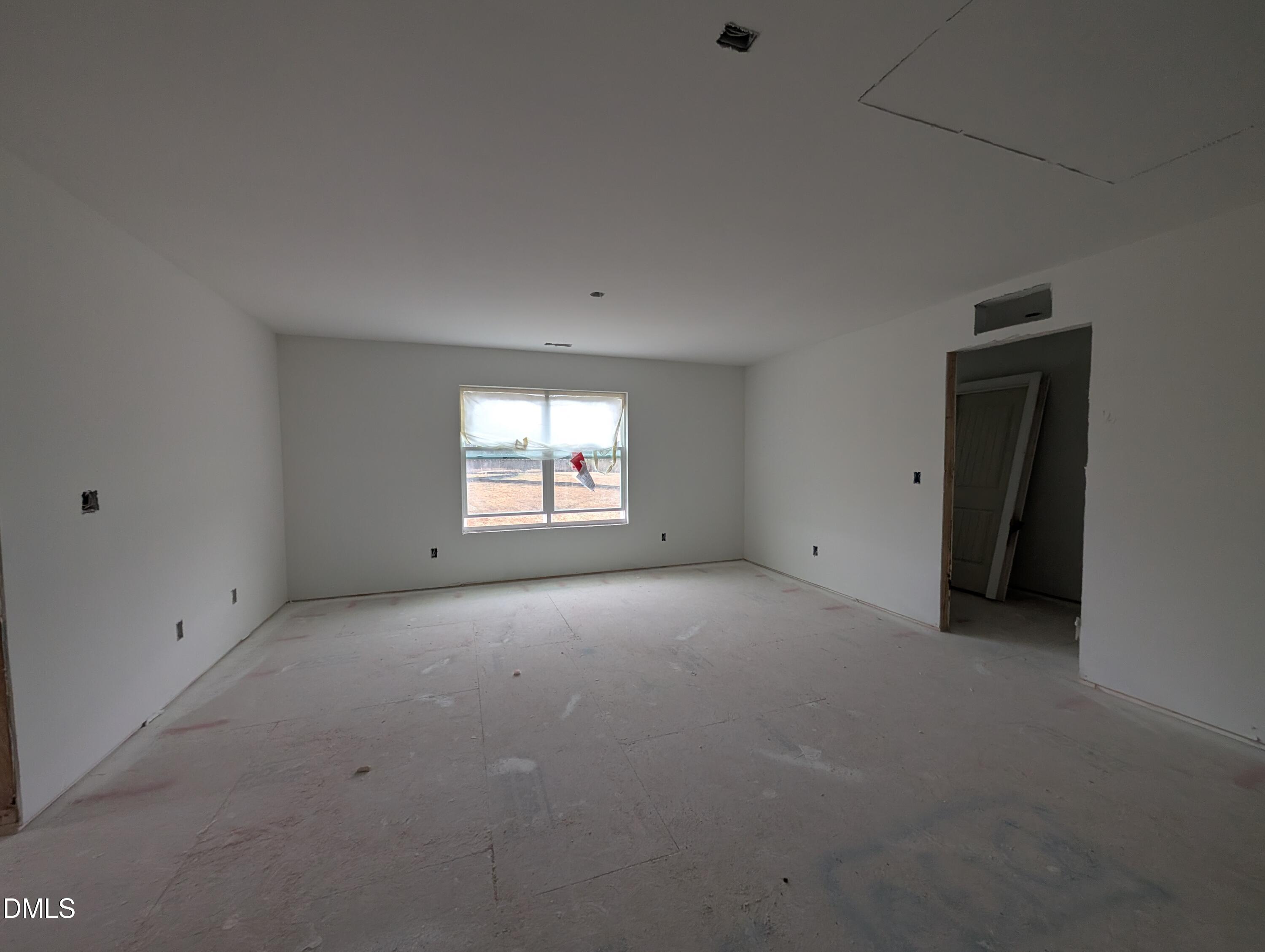 216 Cedar Rdg Trail Angier, NC 27501 - Photo 12 of 18 an empty room with a window and a fireplace