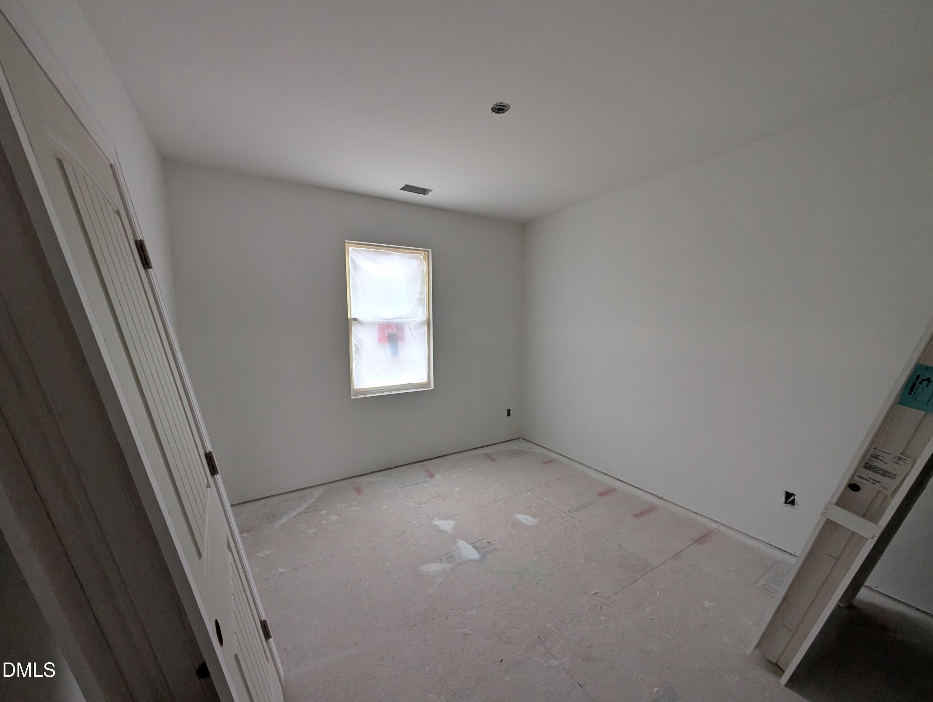 216 Cedar Rdg Trail Angier, NC 27501 - Photo 9 of 18 a view of an empty room with a window