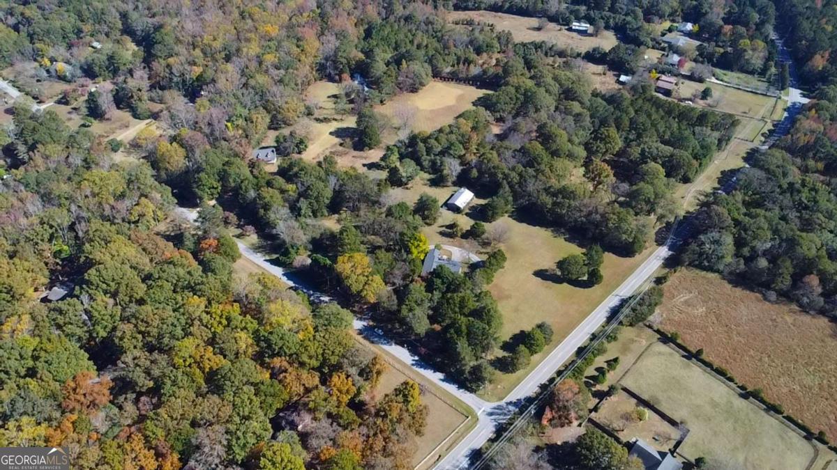 0 Barnett Shoals Road, Unit LOT 1 Athens, GA 30605 - Photo 3 of 17 an aerial view of a house with a yard and lake view