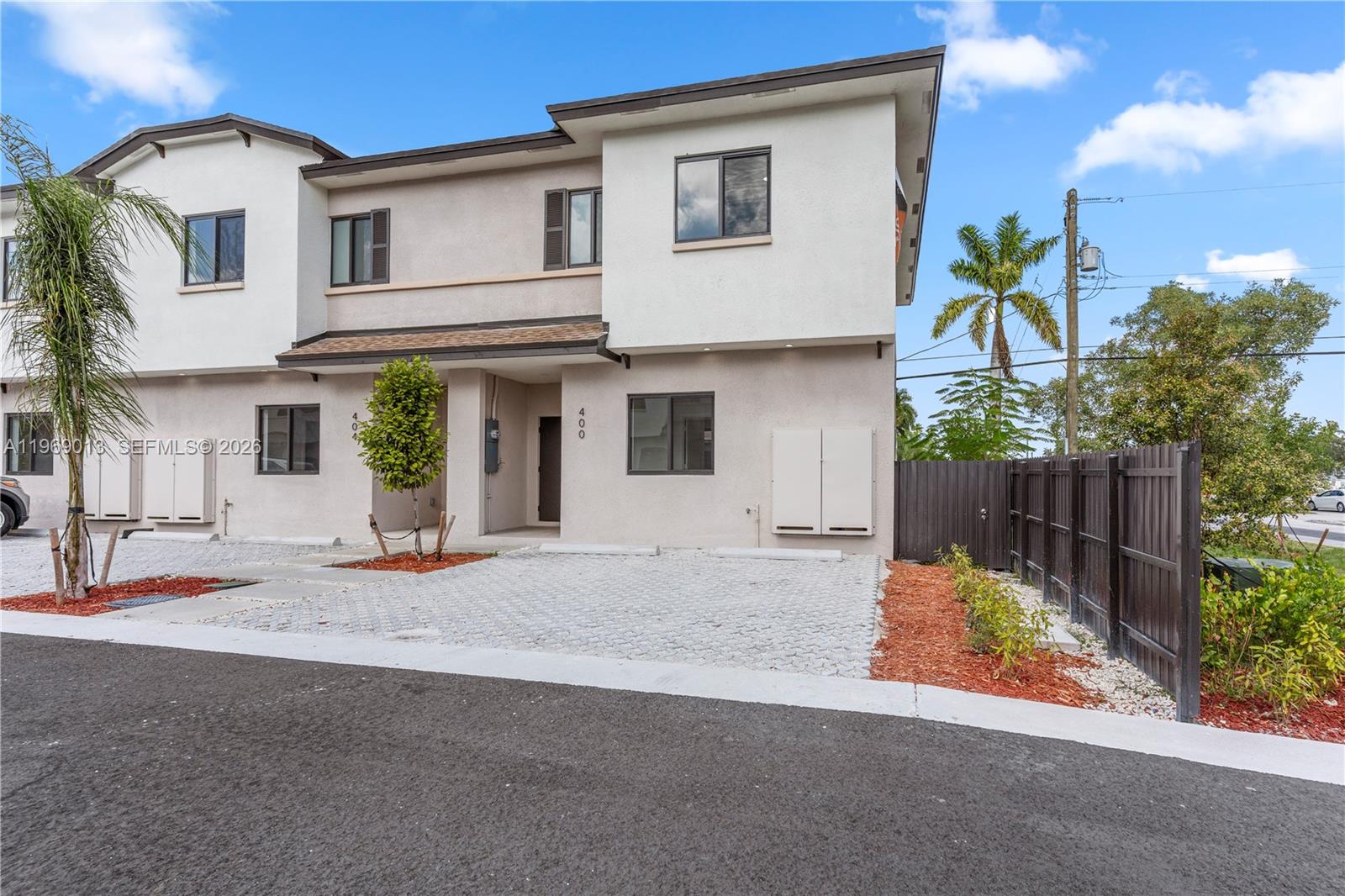 400 Southwest 1st Street, Unit 1 Florida City, FL 33034 - Photo 2 of 28 a view of a house with a small yard and plants
