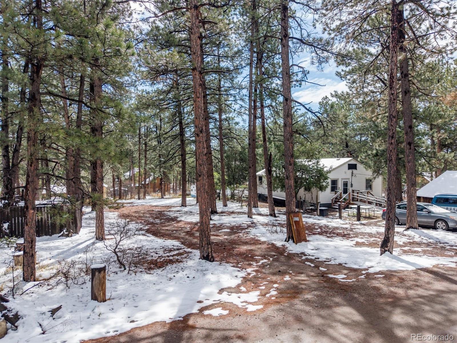 9231 South Curtis Road Larkspur, CO 80118 - Photo 4 of 16 a view of outdoor space with seating