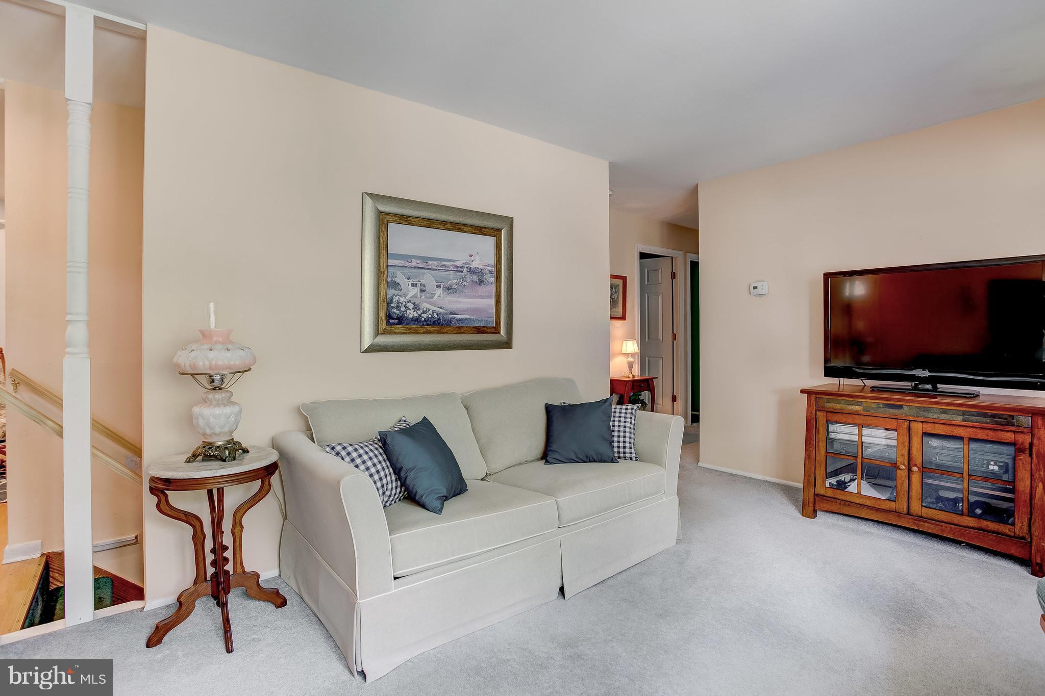 332 Timber Grove Road Reisterstown, MD 21136 - Photo 4 of 23 a living room with furniture and a flat screen tv