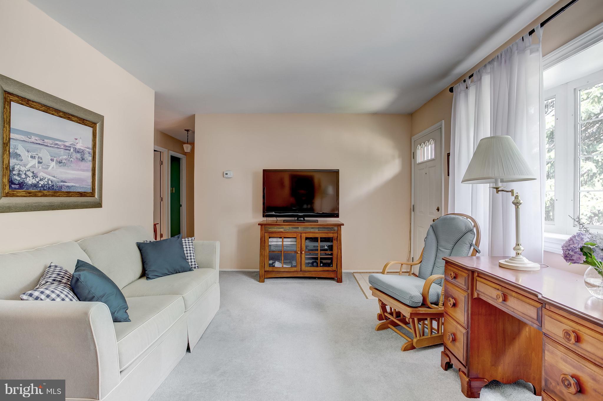 332 Timber Grove Road Reisterstown, MD 21136 - Photo 5 of 23 a living room with furniture and a flat screen tv