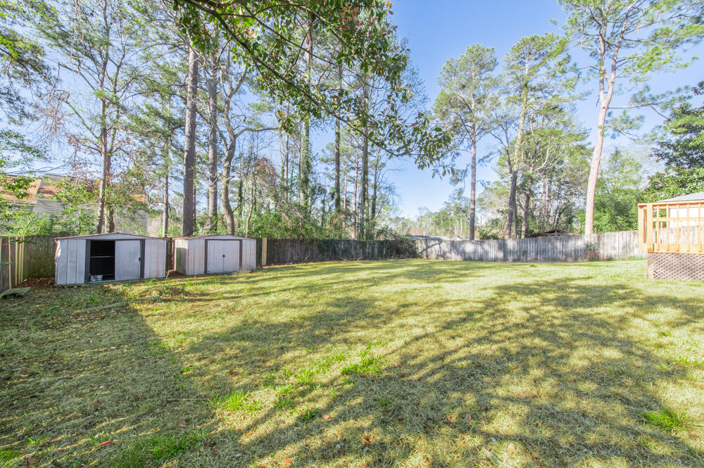 335 Indian Trail Augusta, GA 30907 - Photo 19 of 24 a backyard of a house with lots of green space and fountain