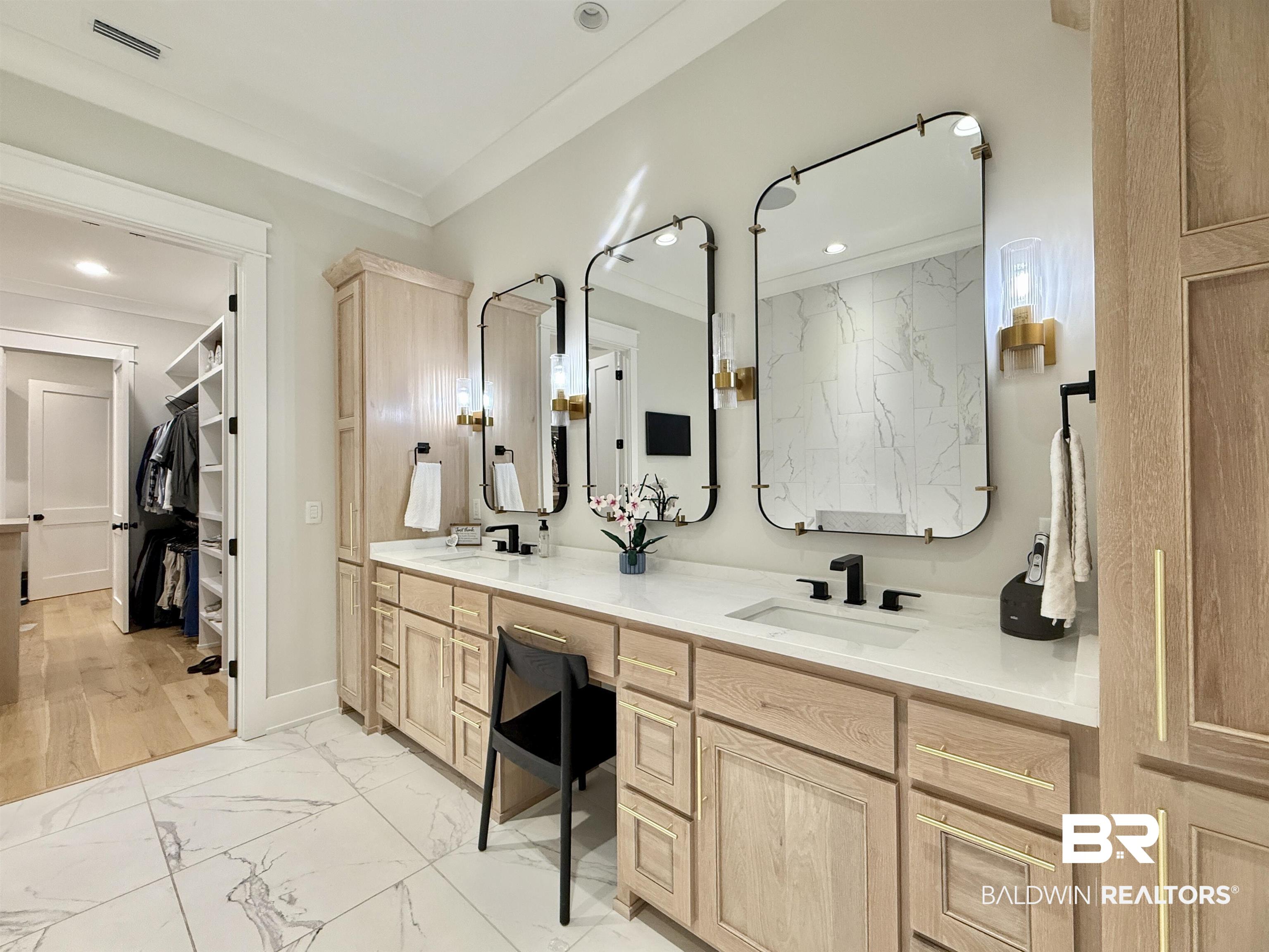 21767 Gallery Boulevard Fairhope, AL 36532 - Photo 30 of 74 Bathroom with marble look tile flooring, double vanity, ornamental molding, and recessed lighting