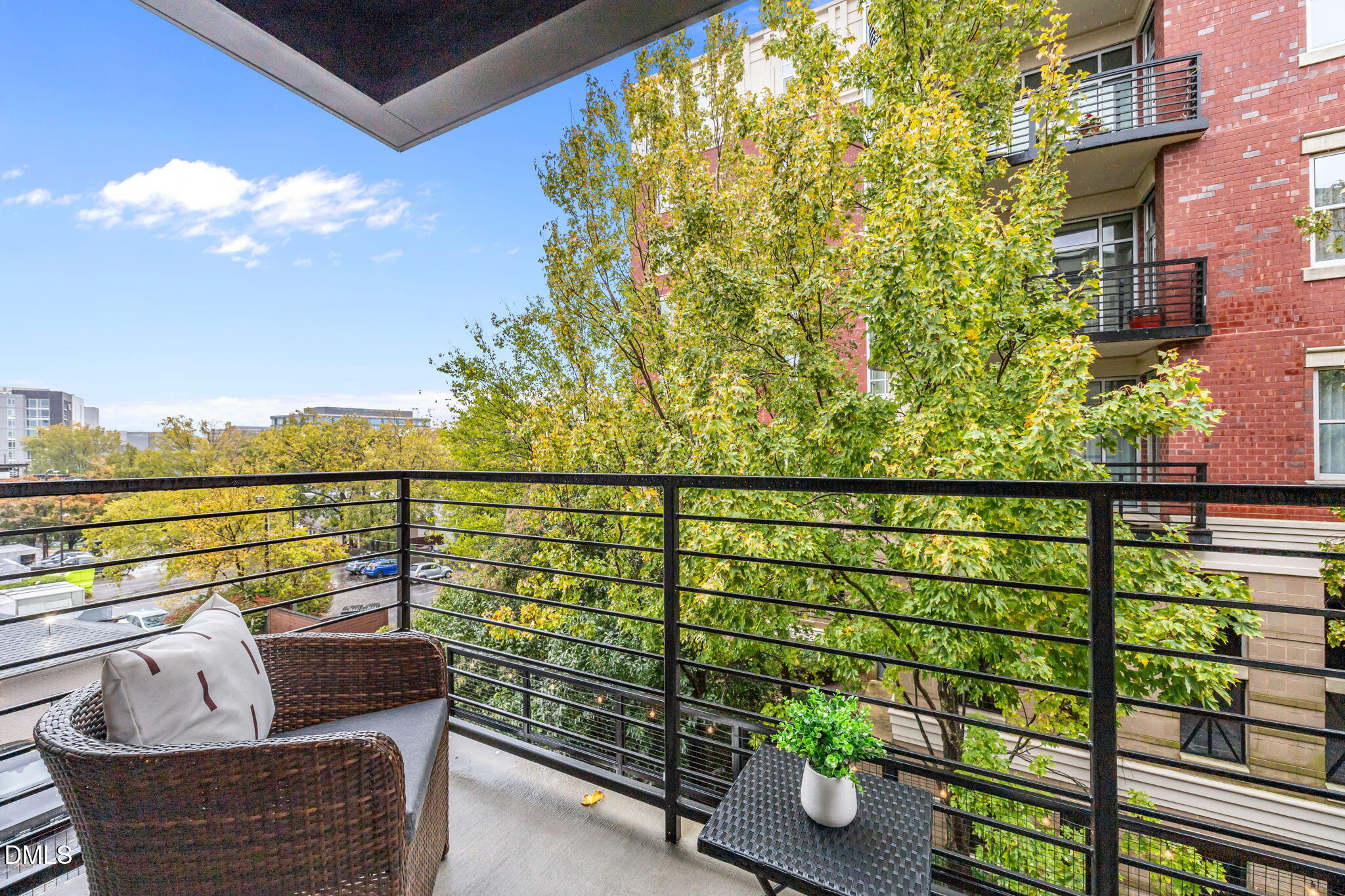 615 West Peace Street, Unit 308 Raleigh, NC 27605 - Photo 11 of 25 a view of a balcony with outdoor seating