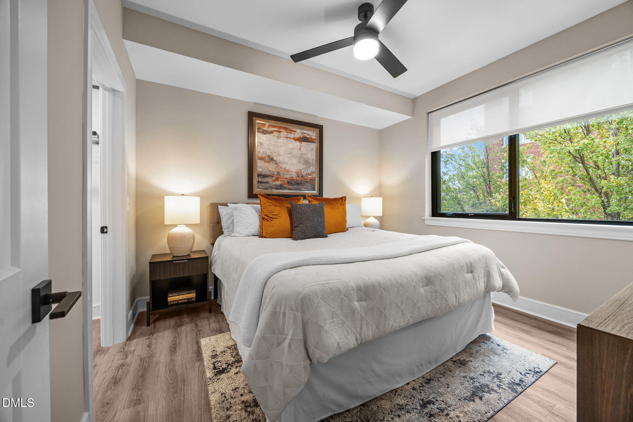 615 West Peace Street, Unit 308 Raleigh, NC 27605 - Photo 12 of 25 a bedroom with a large bed and a window
