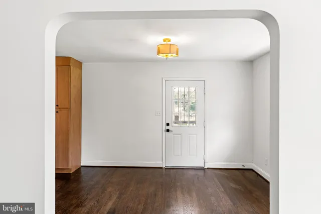 a view of an entryway with wooden floor