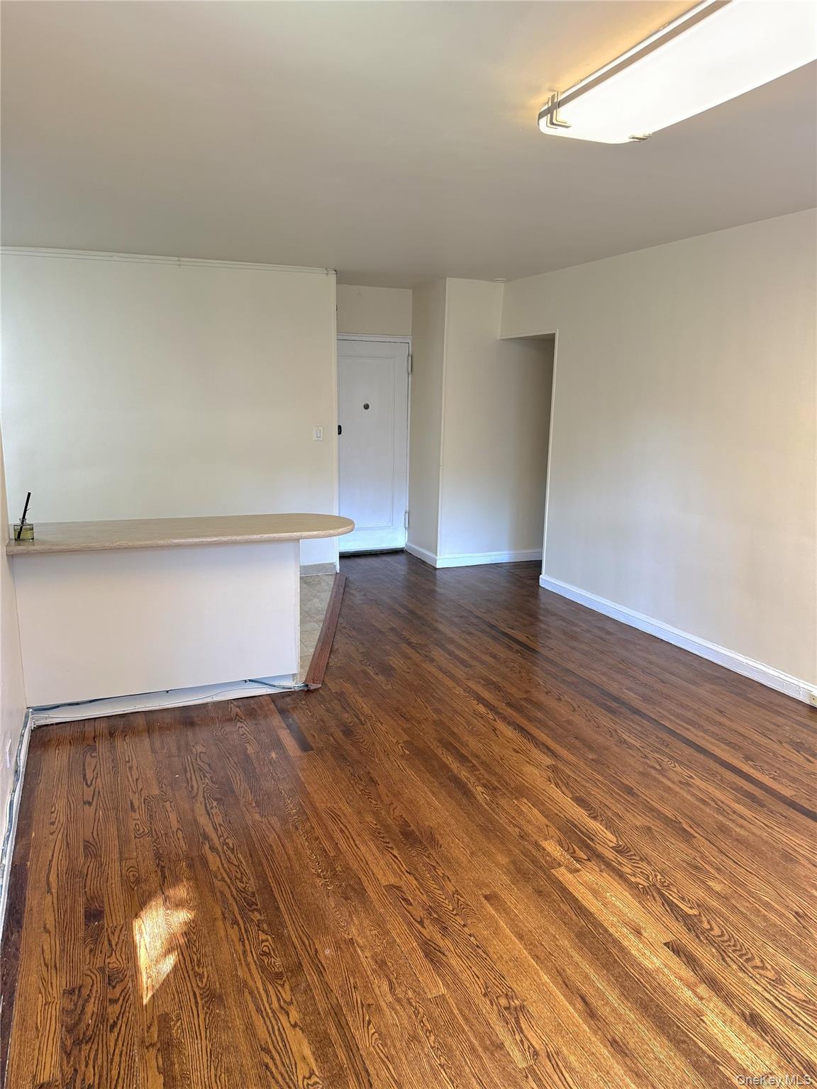 22-27 76th Street, Unit B2 Queens, NY 11370 - Photo 5 of 12 a view of an empty room with wooden floor