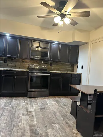 a kitchen with a stove and a cabinets