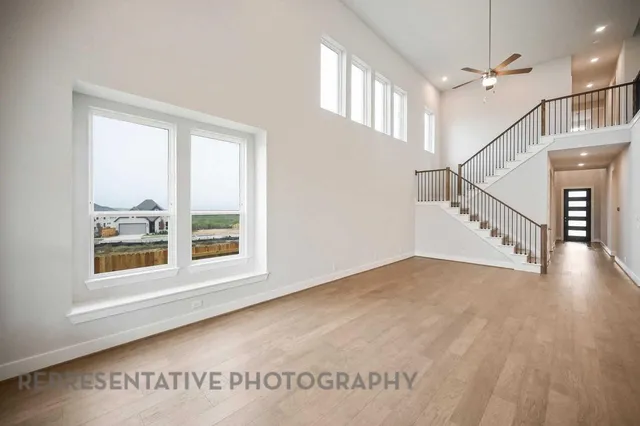 a view of an entryway with wooden floor