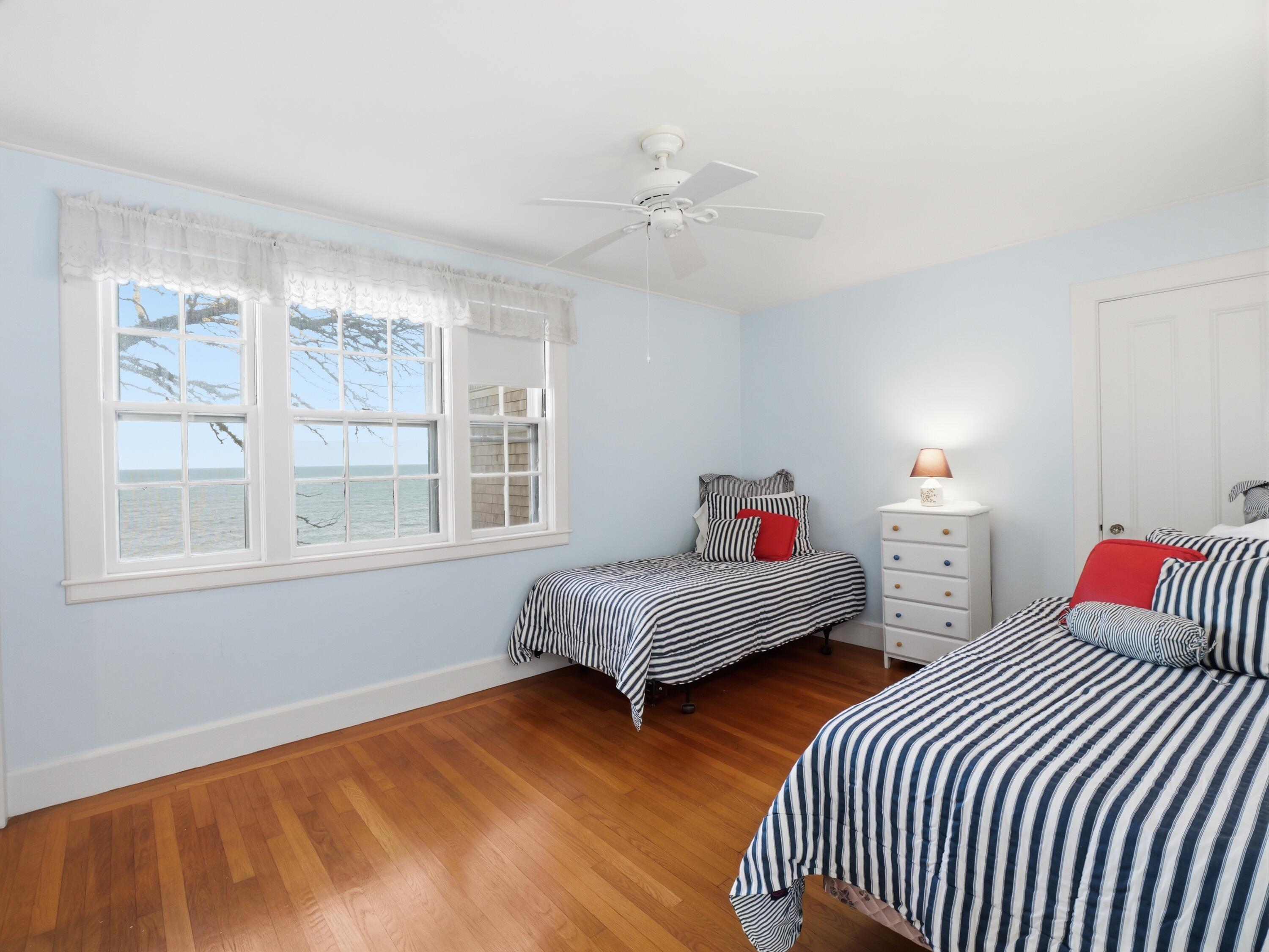 190 Vineyard Road Cotuit, MA 02635 - Photo 24 of 41 a bedroom with two beds and a large window